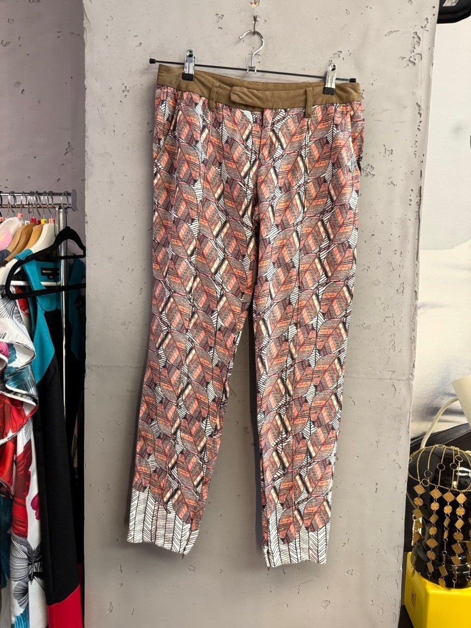 BERLIN VINTAGE CORNER Custo Barcelona trousers featuring a rust, cream, and charcoal leaf print with an olive waistband.