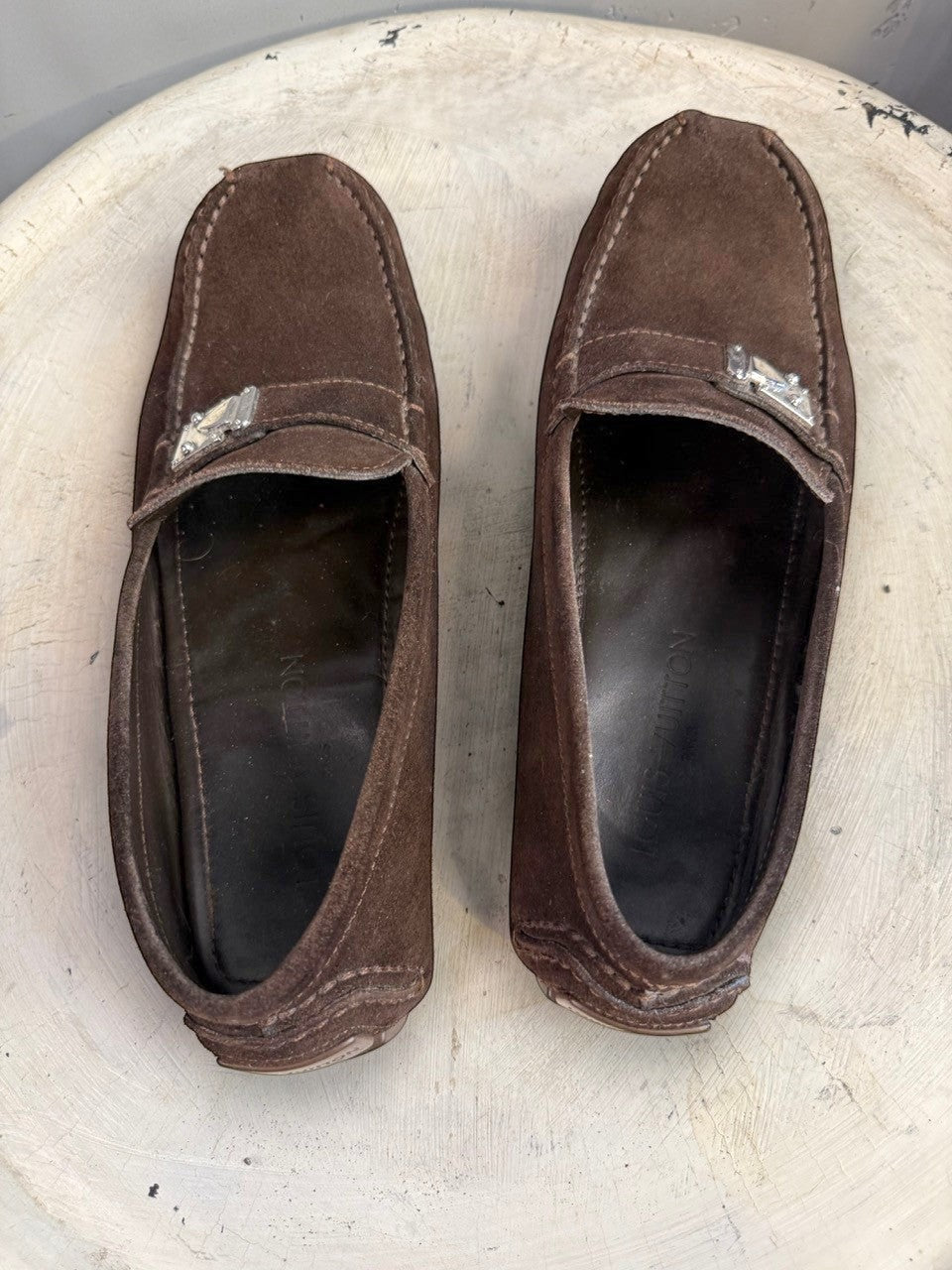 BERLIN VINTAGE CORNER dark brown suede driving loafers with metal detail and moc-toe construction.