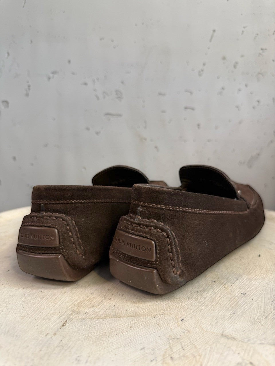 BERLIN VINTAGE CORNER dark brown suede driving loafers with metal detail and moc-toe construction.