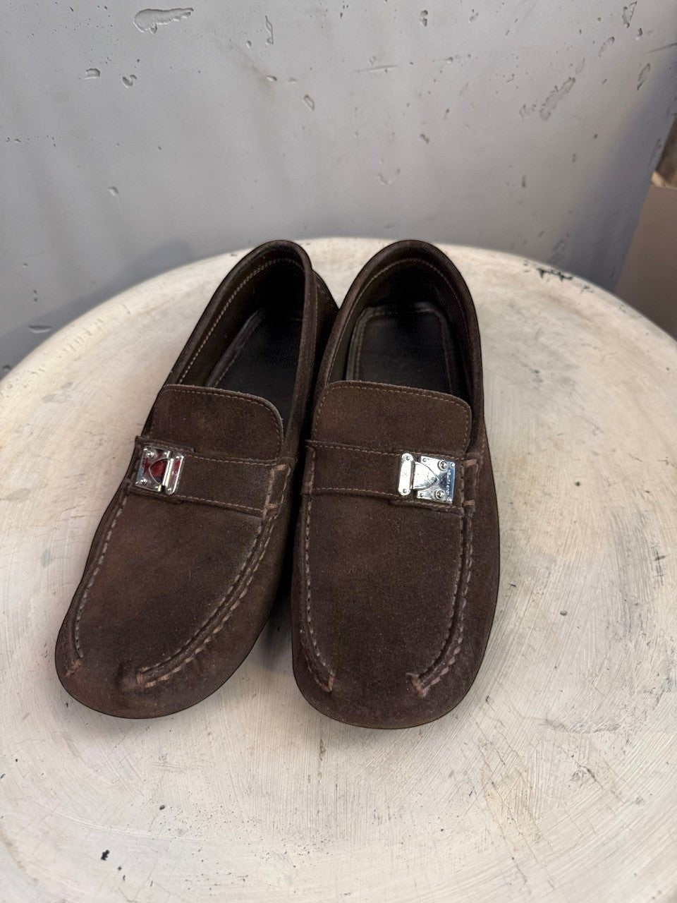 BERLIN VINTAGE CORNER dark brown suede driving loafers with metal detail and moc-toe construction.