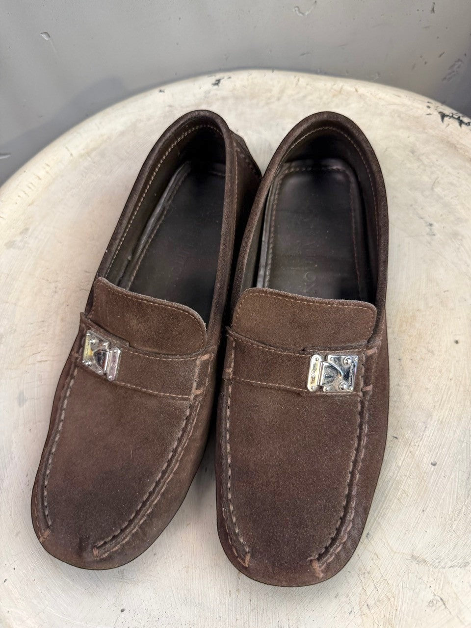BERLIN VINTAGE CORNER dark brown suede driving loafers with metal detail and moc-toe construction.
