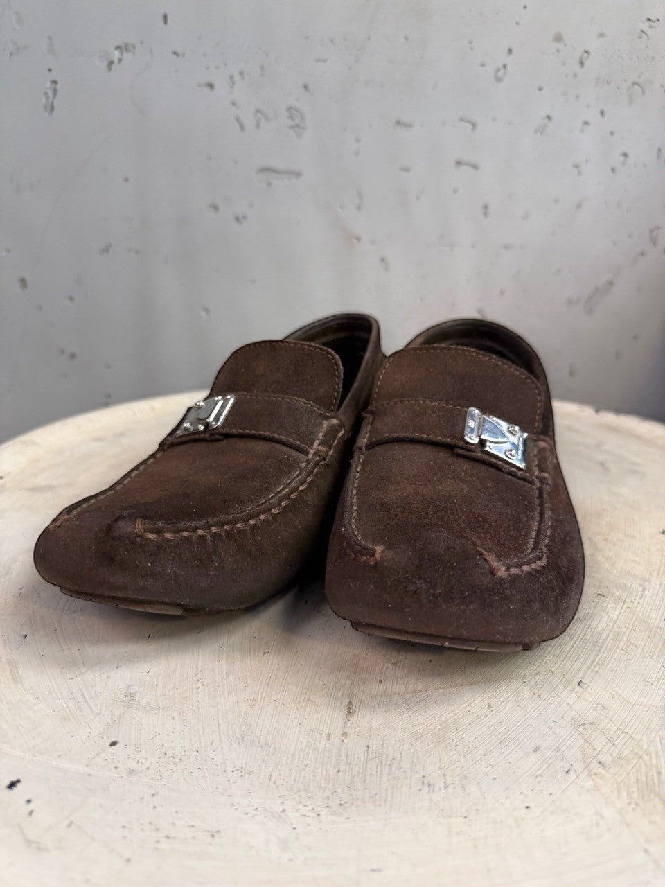 BERLIN VINTAGE CORNER dark brown suede driving loafers with metal detail and moc-toe construction.