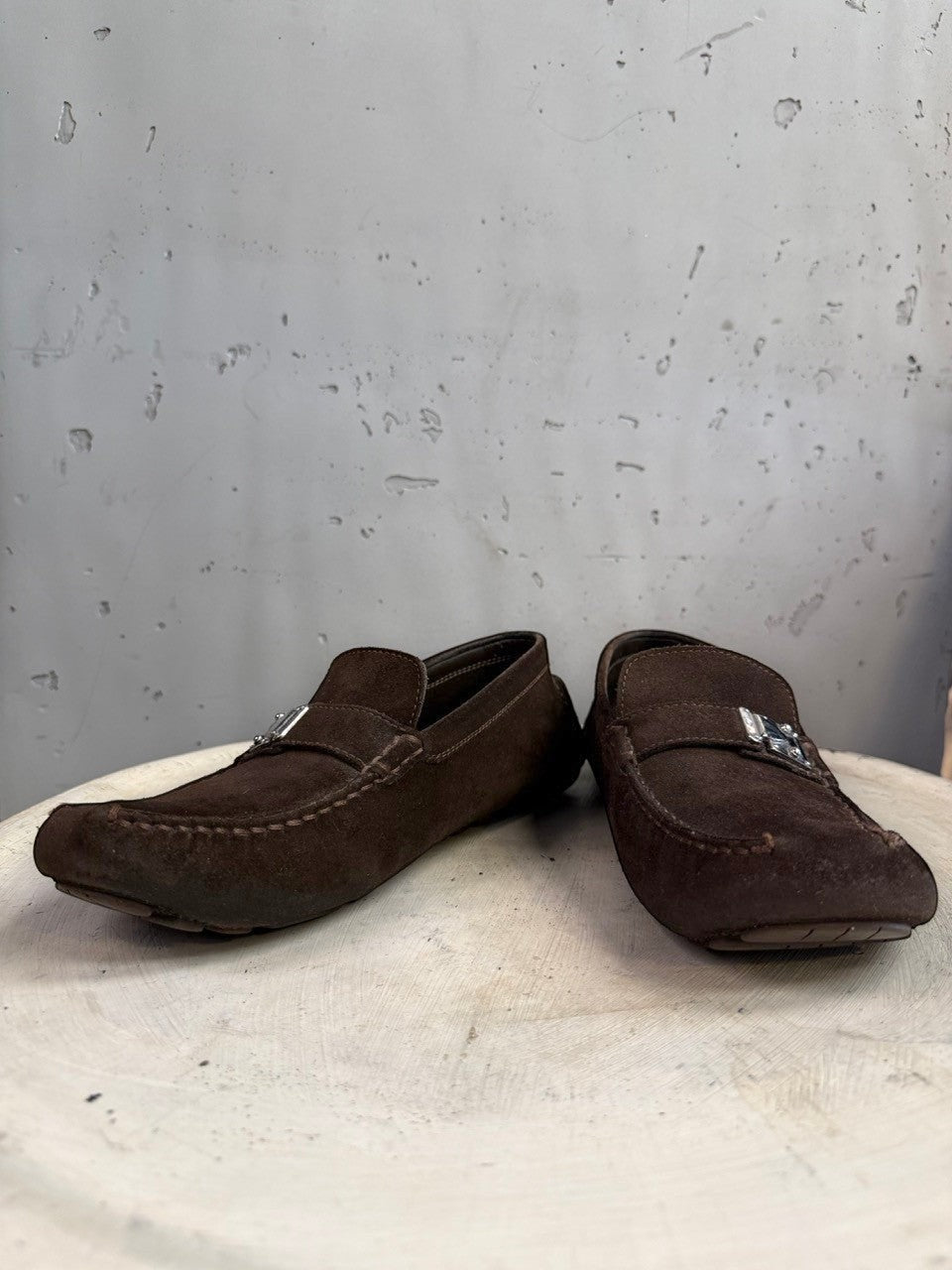 BERLIN VINTAGE CORNER dark brown suede driving loafers with metal detail and moc-toe construction.