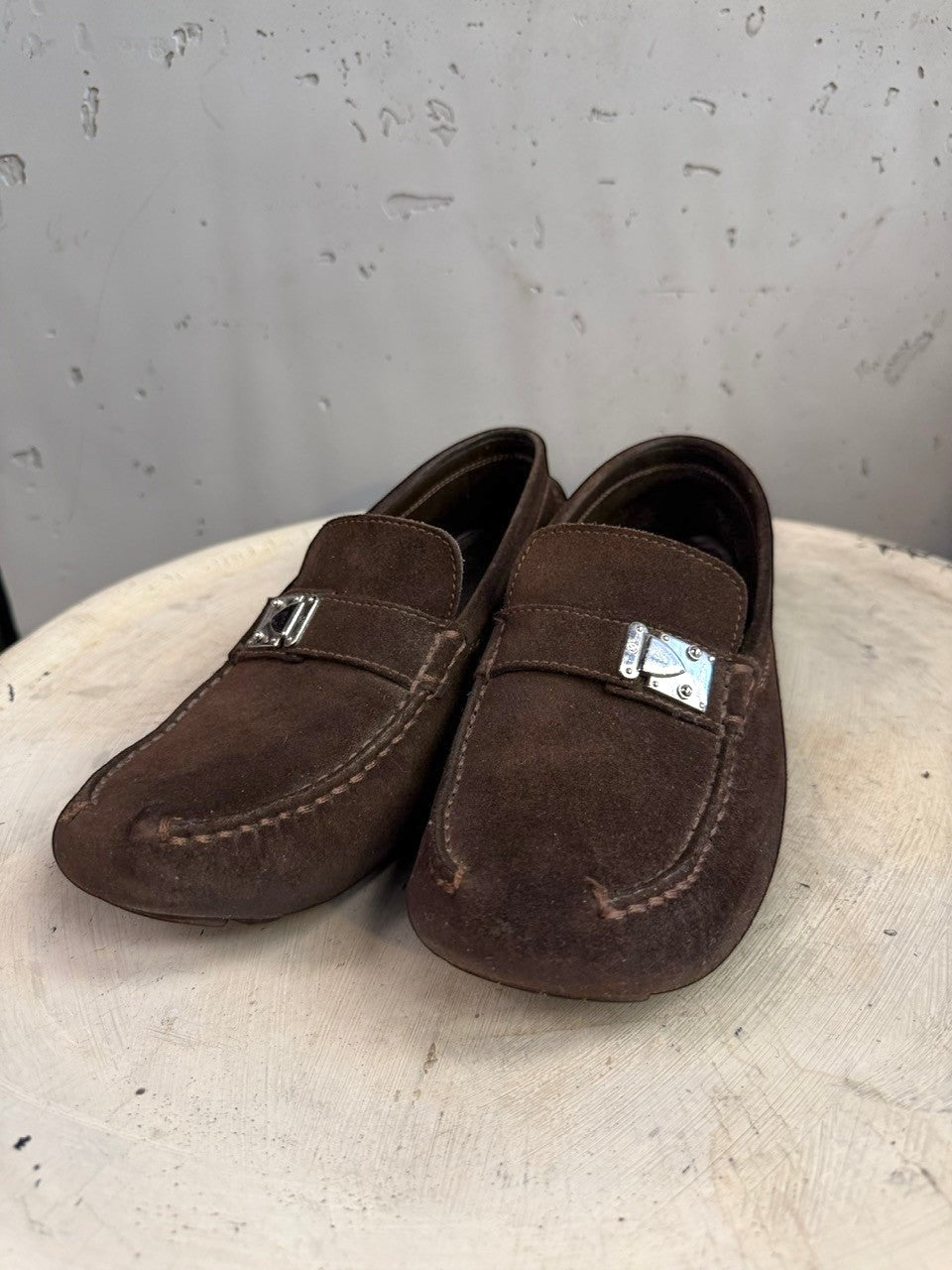 BERLIN VINTAGE CORNER dark brown suede driving loafers with metal detail and moc-toe construction.