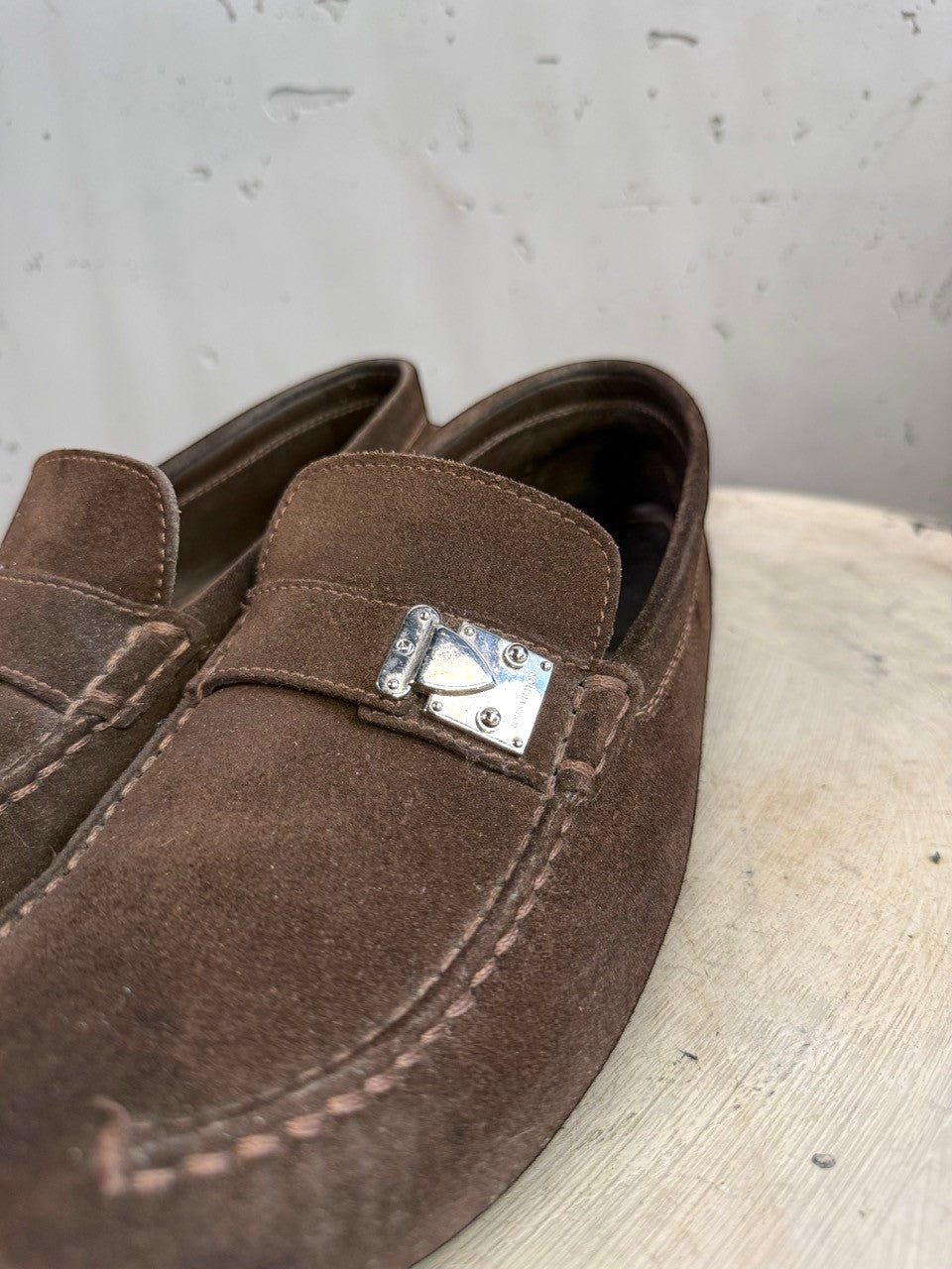 BERLIN VINTAGE CORNER dark brown suede driving loafers with metal detail and moc-toe stitching.
