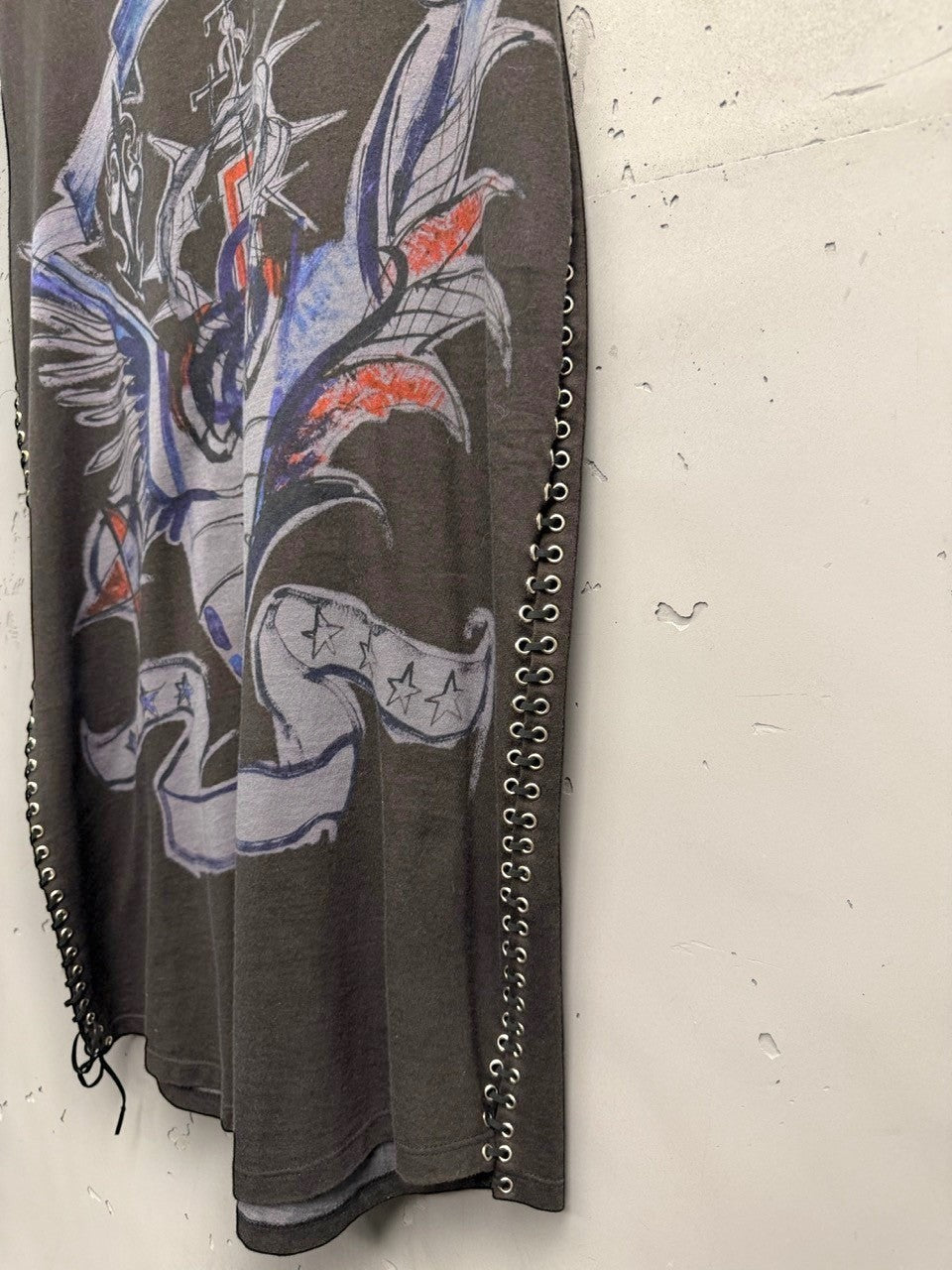 BERLIN VINTAGE CORNER dark grey cotton sleeveless top with graphic print and side grommet lacing detail.