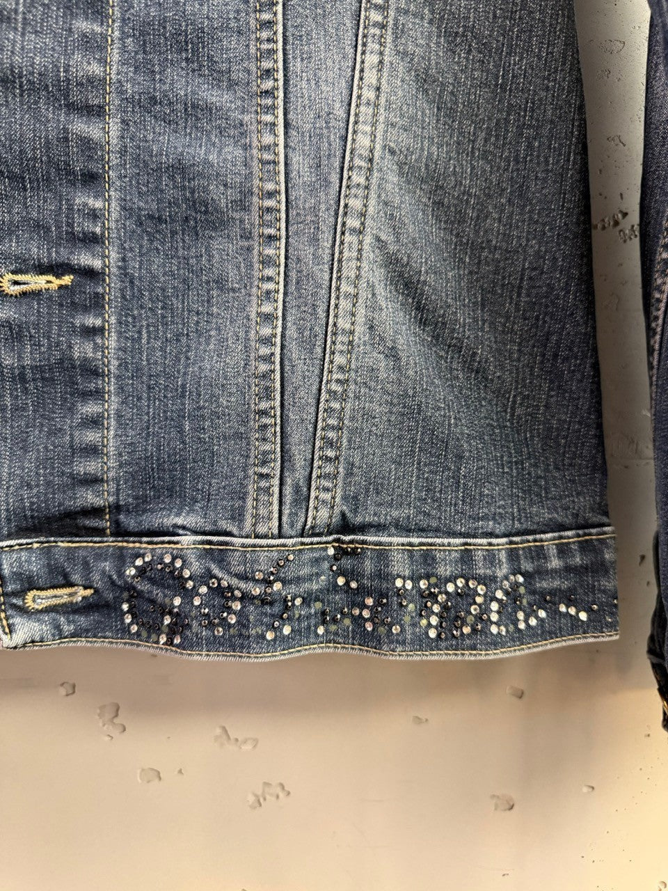 BERLIN VINTAGE CORNER D&G denim jacket in medium wash with crystal embellishments along the hem.