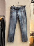 BERLIN VINTAGE CORNER mid-wash distressed denim jeans with integrated belt and orange stitching.