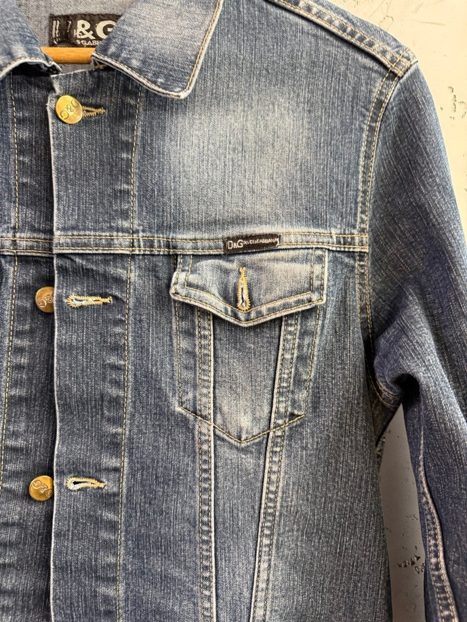 BERLIN VINTAGE CORNER D&G Dolce & Gabbana medium wash denim jacket with branded metallic buttons and chest pocket.
