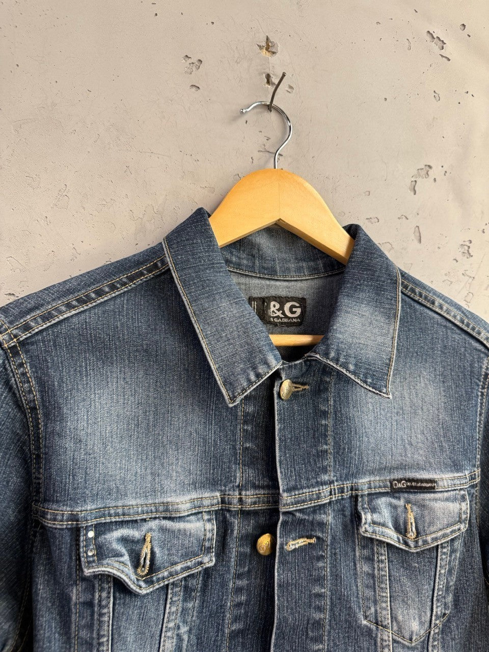 BERLIN VINTAGE CORNER D&G Dolce & Gabbana medium wash denim jacket with crystal accents and branded metal buttons.
