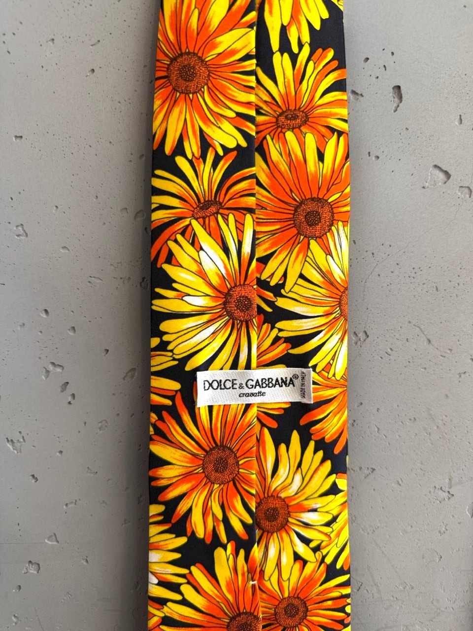 BERLIN VINTAGE CORNER Dolce & Gabbana silk tie with bold yellow and orange sunflowers on black. Features split design.