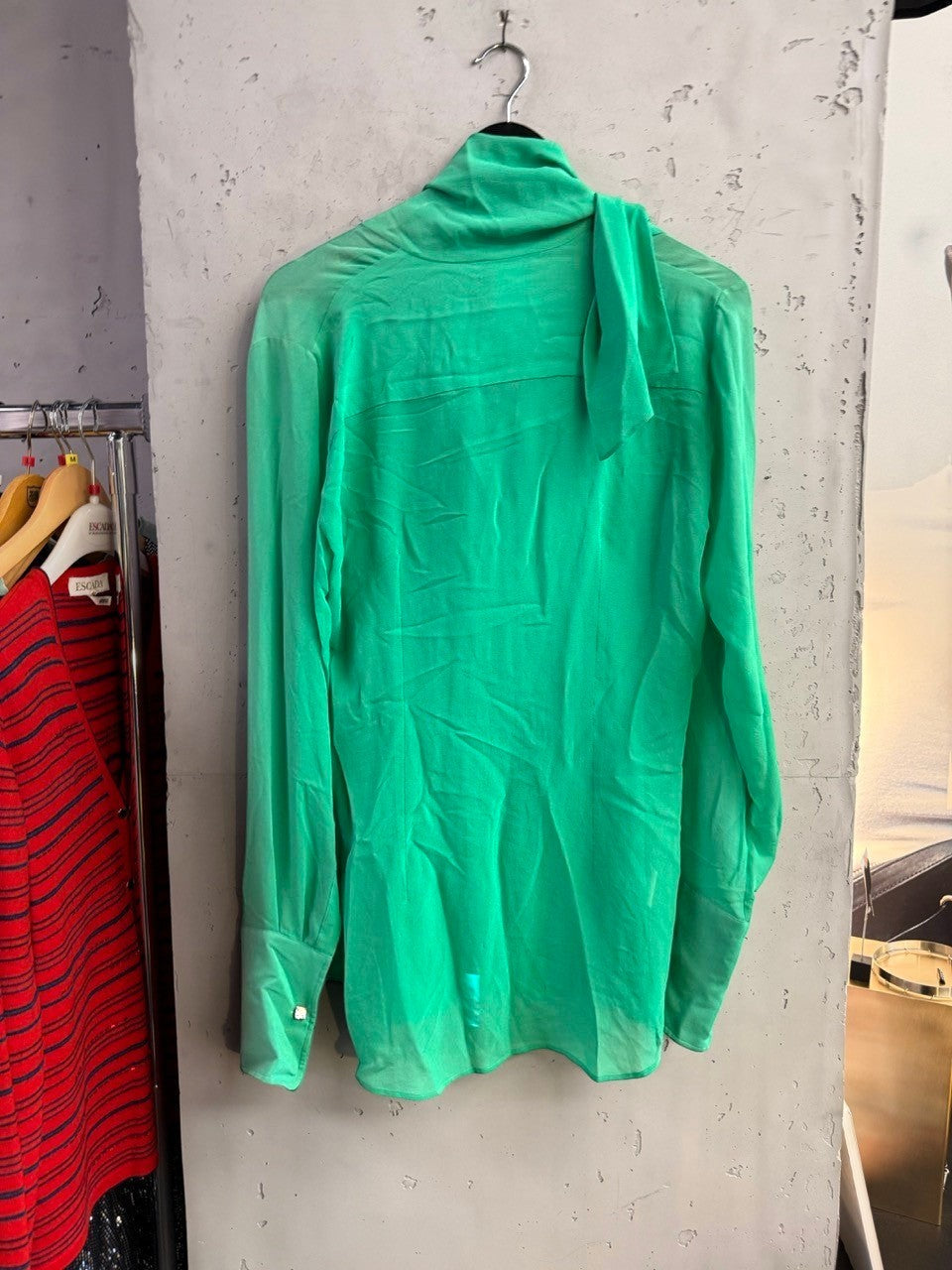 BERLIN VINTAGE CORNER emerald green Dolce & Gabbana silk pussy bow blouse with long sleeves and structured cuffs.