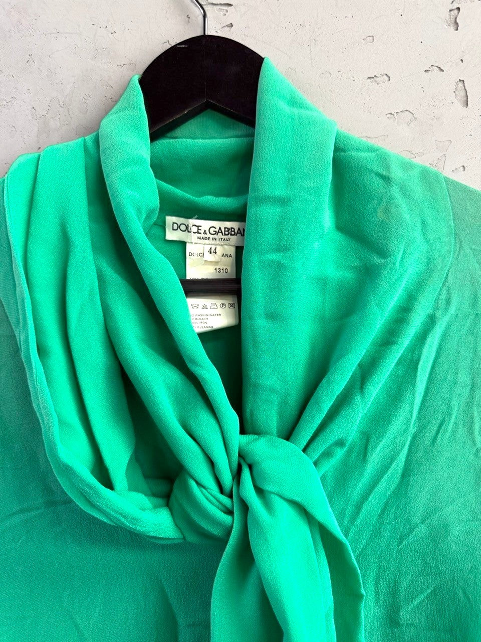 Emerald green Dolce & Gabbana silk pussy bow blouse from BERLIN VINTAGE CORNER with elegant draped neckline.