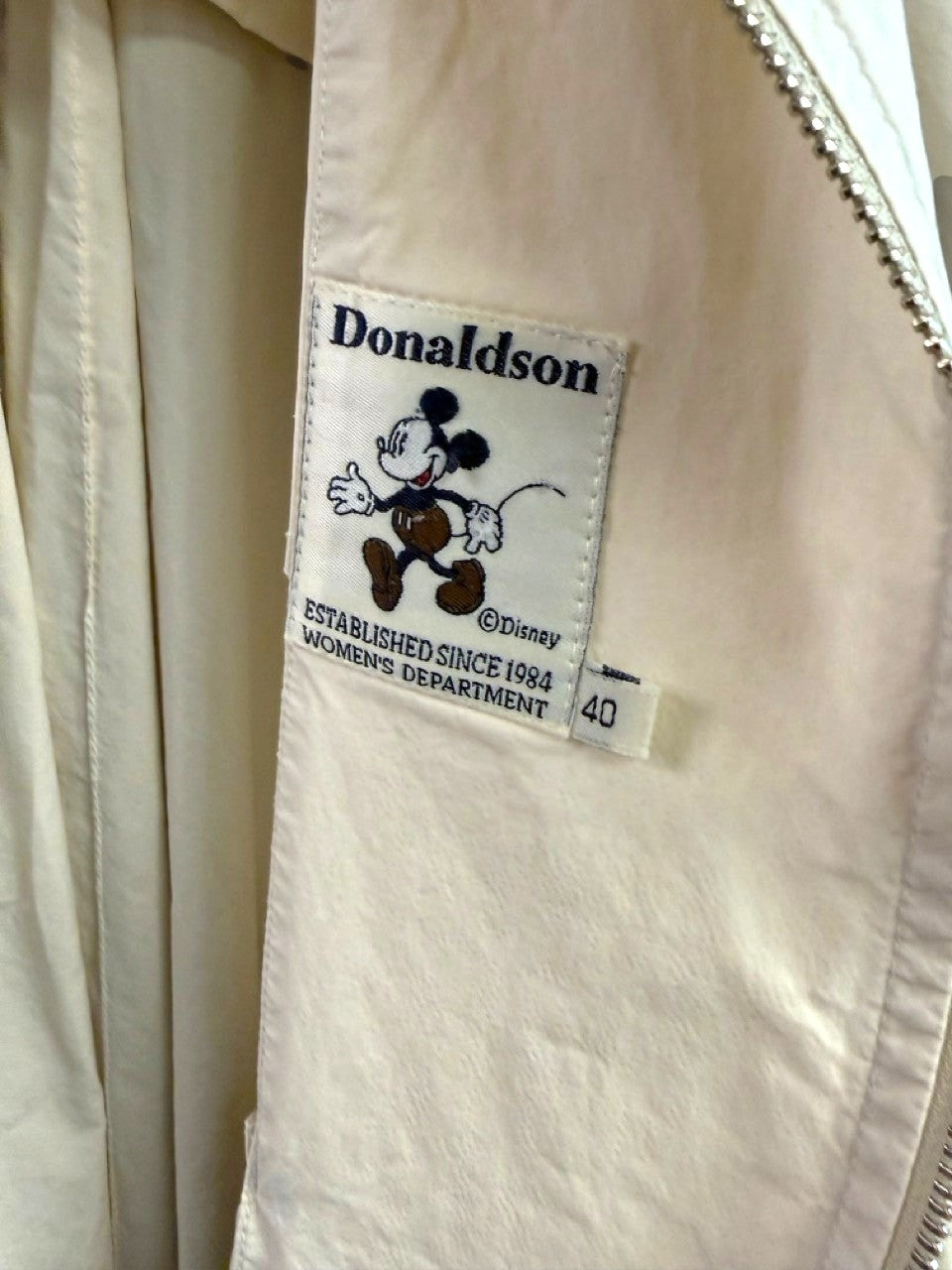 BERLIN VINTAGE CORNER off-white Donaldson trench coat interior label with vintage Mickey Mouse graphic