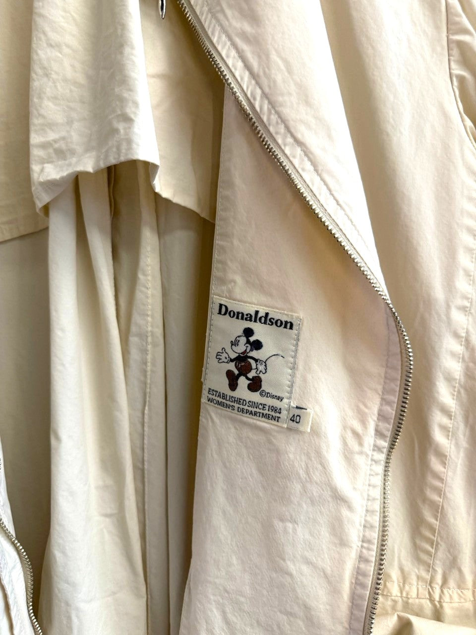 BERLIN VINTAGE CORNER off-white Donaldson trench coat with interior Mickey Mouse label and full-length zipper