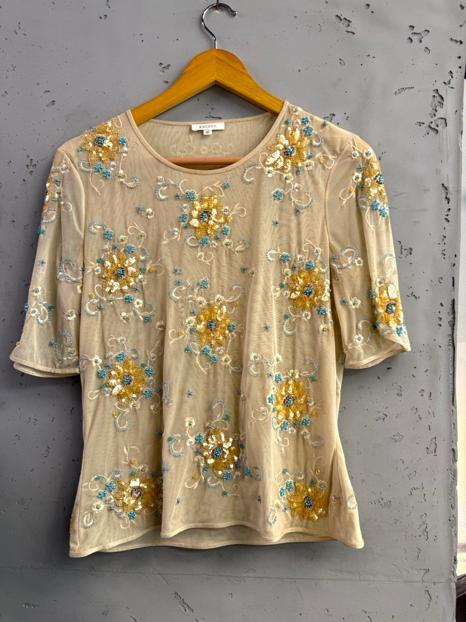BERLIN VINTAGE CORNER sheer mesh blouse with short sleeves, embellished with gold and turquoise floral embroidery and beads.