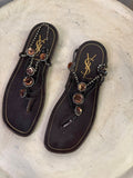 BERLIN VINTAGE CORNER dark brown leather thong sandals with rhinestone and amber embellishments and YSL logo.