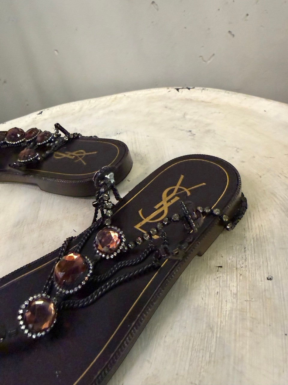 BERLIN VINTAGE CORNER dark brown leather thong sandals with rhinestones and amber-toned jewels.