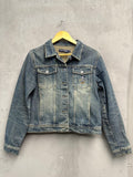 BERLIN VINTAGE CORNER blue washed denim trucker jacket with embroidered Mickey Mouse motif on chest pocket.