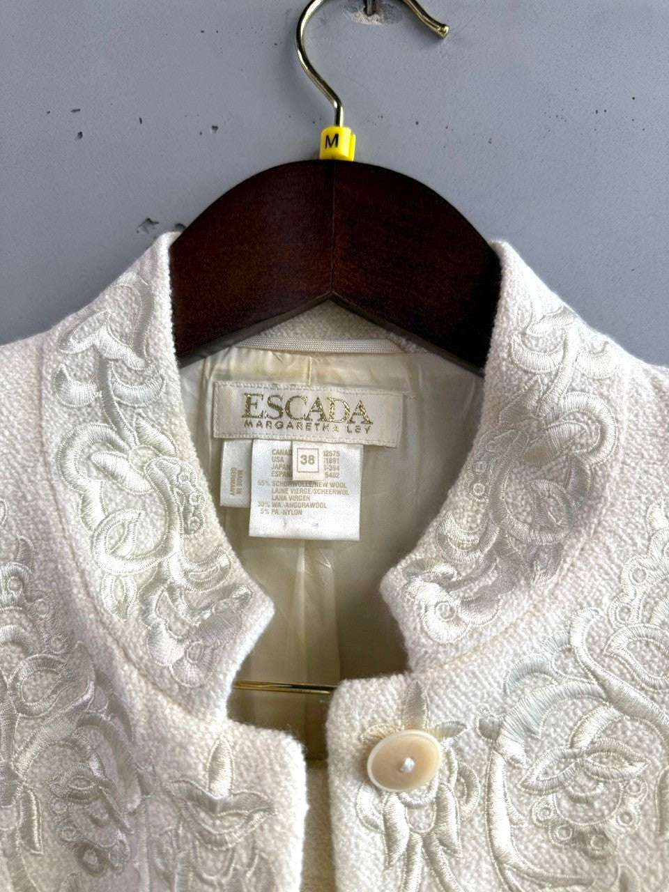 BERLIN VINTAGE CORNER cream wool-silk blend jacket with tonal embroidery and button closure.