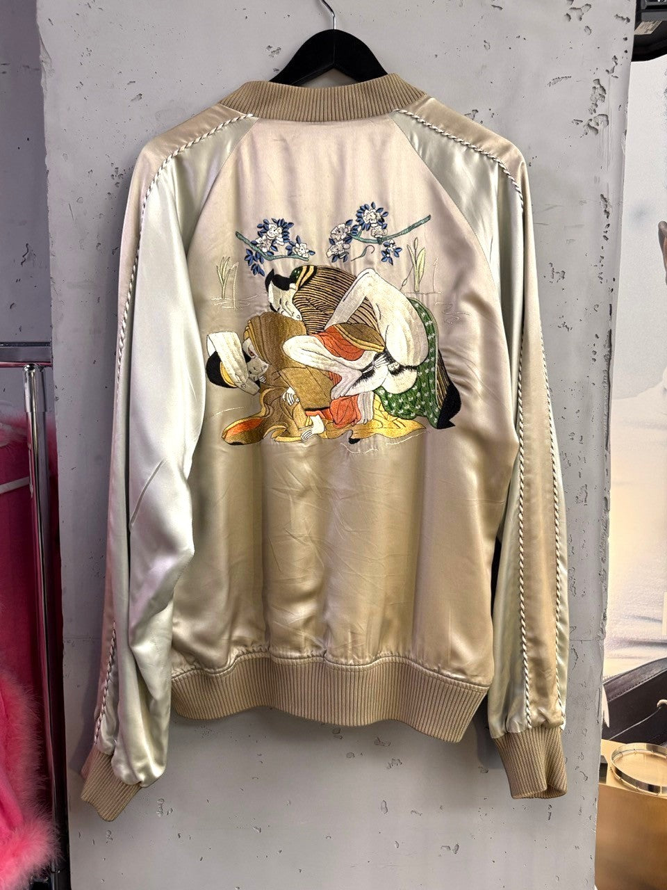 BERLIN VINTAGE CORNER champagne satin bomber jacket with traditional Japanese embroidery on back. Ribbed collar, cuffs, and hem.