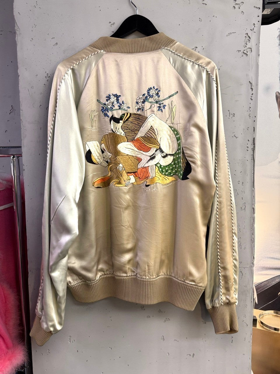 BERLIN VINTAGE CORNER champagne satin bomber jacket with traditional Japanese embroidery on back, ribbed collar, cuffs, and hem.