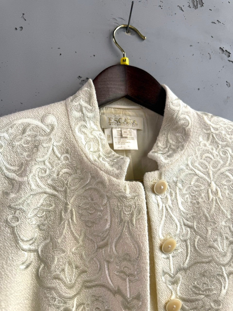 BERLIN VINTAGE CORNER cream wool silk blend jacket and skirt set with tonal embroidery and button closure.