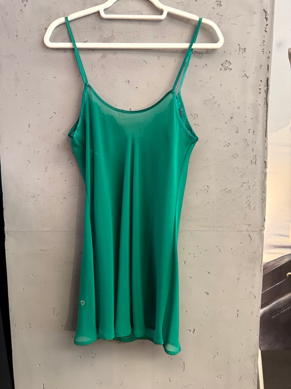 BERLIN VINTAGE CORNER emerald green sheer camisole slip dress with lace trim and a small rhinestone heart detail.