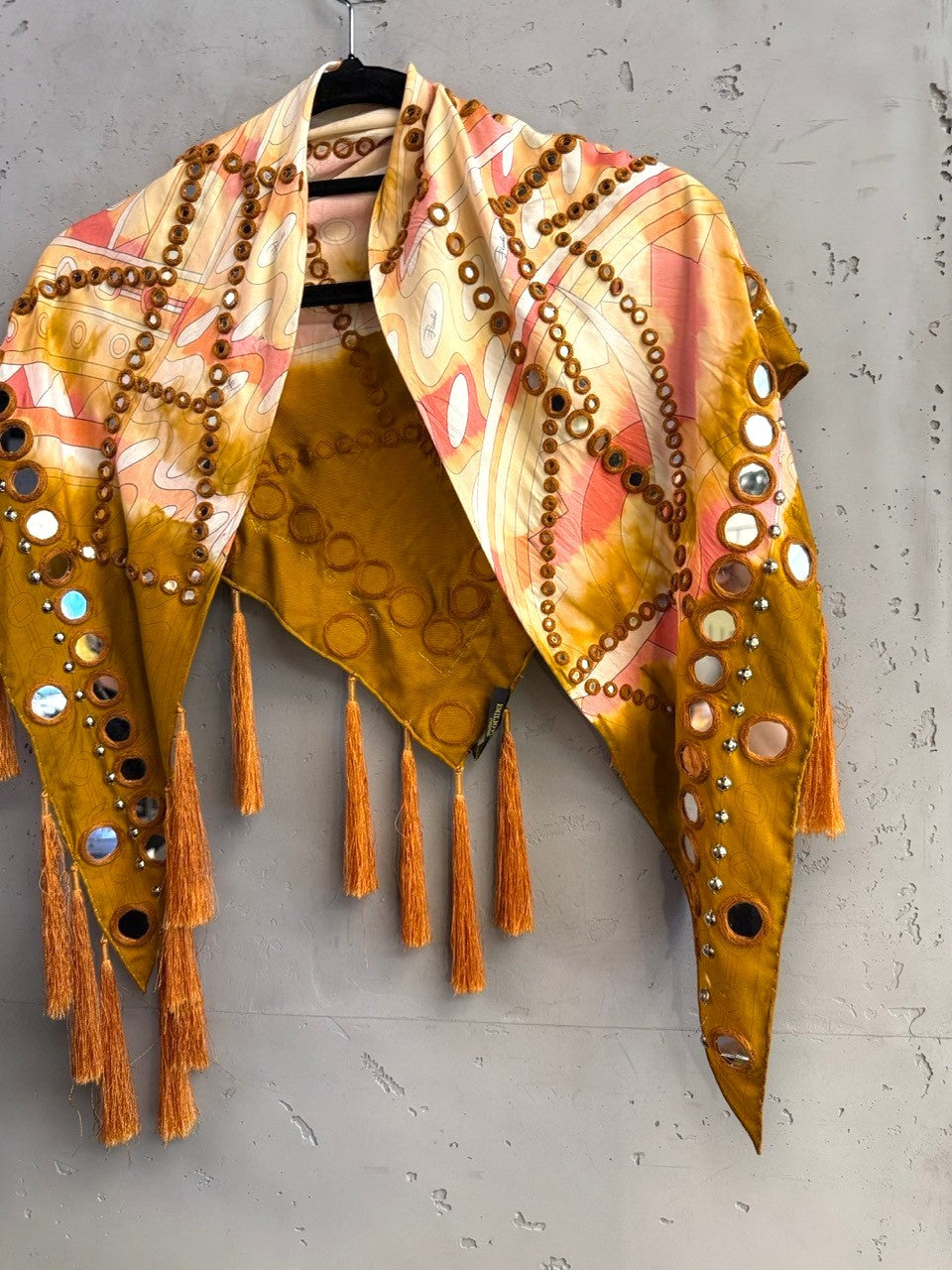 BERLIN VINTAGE CORNER Emilio Pucci mustard scarf with abstract print, mirror embellishments, and hanging tassels.