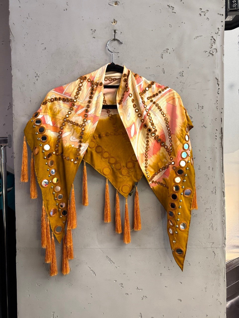 BERLIN VINTAGE CORNER Emilio Pucci mustard scarf with abstract sunset print, mirror embellishments, and tassel trim.