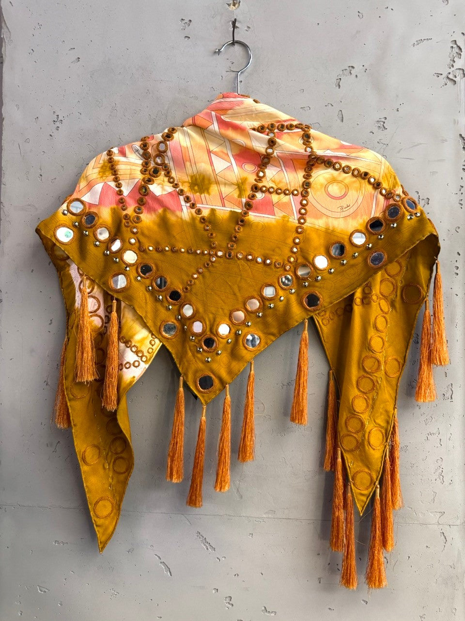 BERLIN VINTAGE CORNER Emilio Pucci mustard scarf with abstract sunset print, mirror embellishments, and tassel trim.