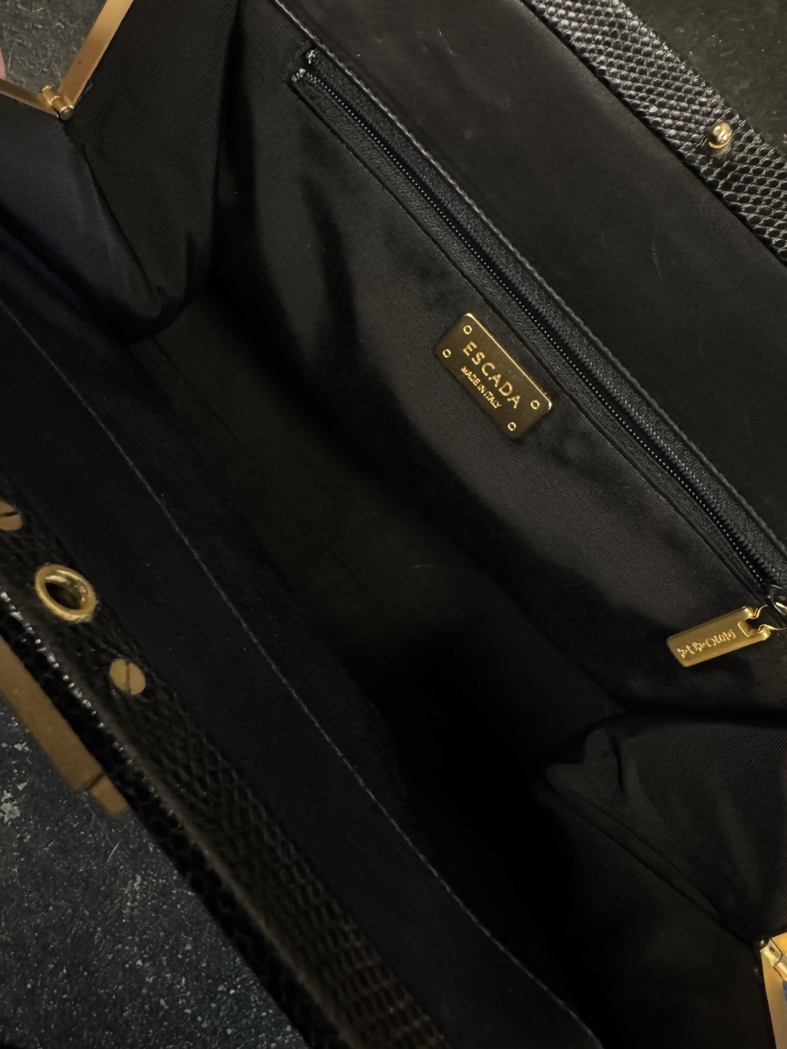 BERLIN VINTAGE CORNER ESCADA vintage black handbag interior with gold logo plaque and zippered pocket
