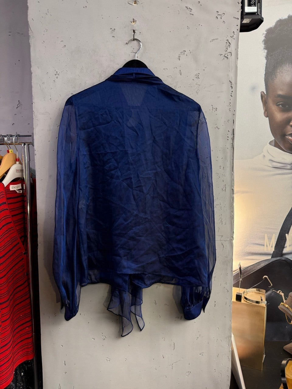 BERLIN VINTAGE CORNER Escada royal blue sheer long sleeve blouse with tie-neck detail and buttoned cuffs.