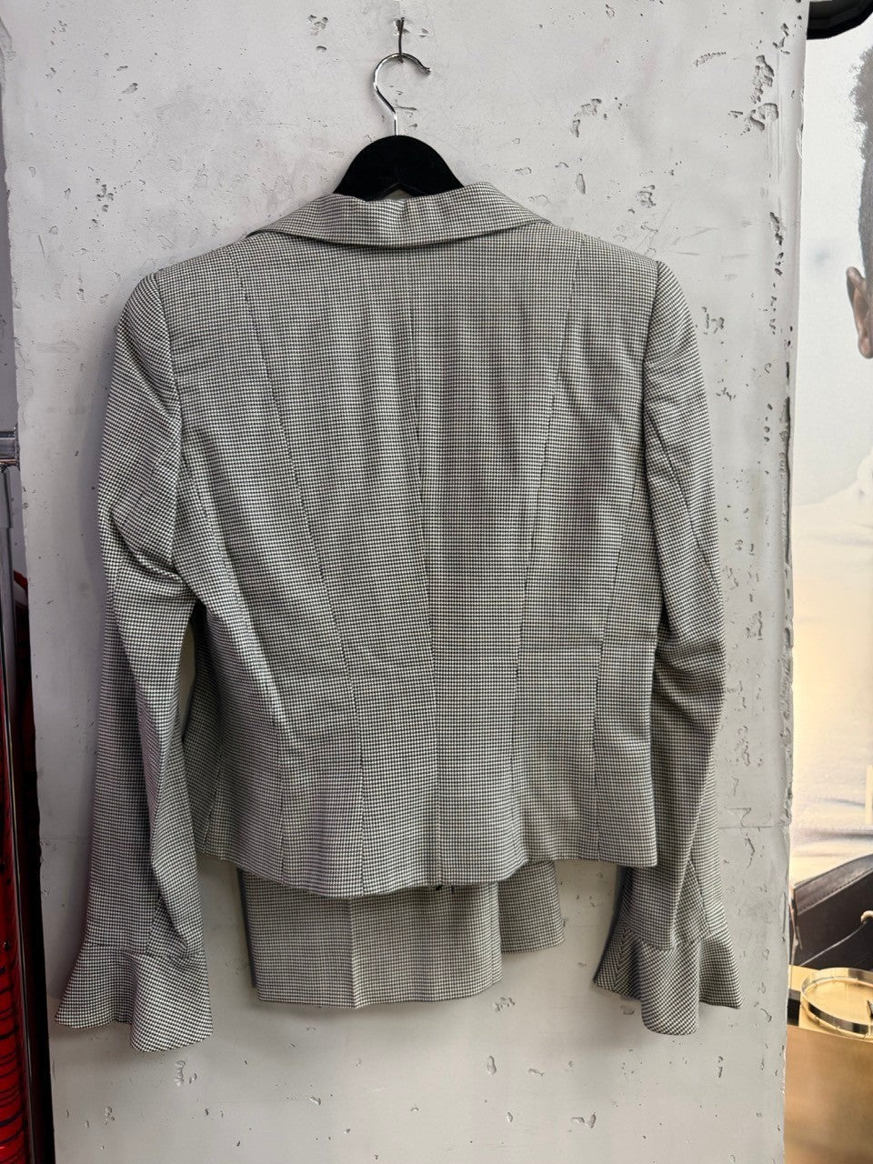 BERLIN VINTAGE CORNER Escada black and white houndstooth tailored suit set with flared sleeve cuffs on a hanger.