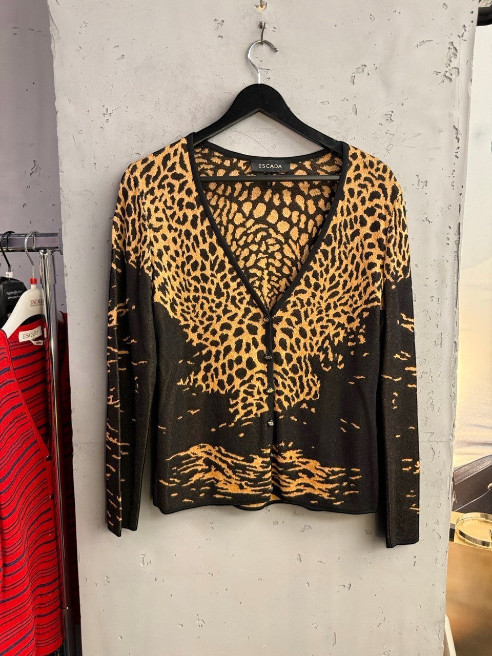 BERLIN VINTAGE CORNER ESCADA knit cardigan featuring a black and gold leopard print pattern with a V-neckline.
