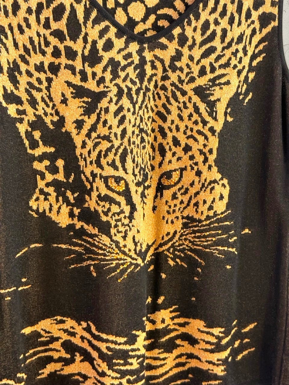 BERLIN VINTAGE CORNER Escada sleeveless knit top with a black and gold leopard face print and V-neckline.