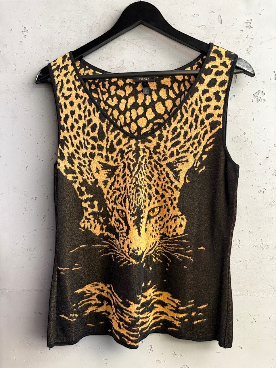 BERLIN VINTAGE CORNER Escada sleeveless knit top with a black and gold leopard print design and V-neckline.