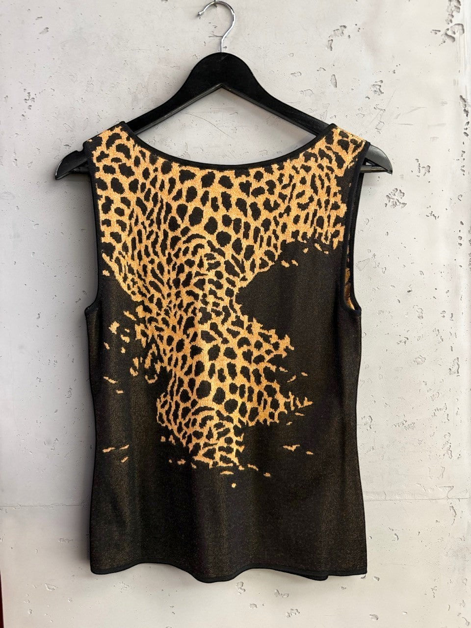 BERLIN VINTAGE CORNER Escada sleeveless knit top in black and gold with a bold leopard print pattern.