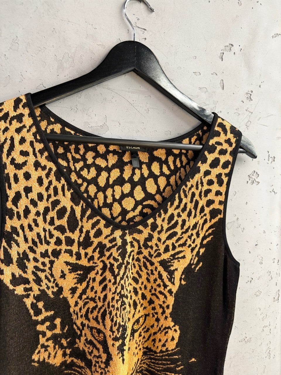 BERLIN VINTAGE CORNER Escada sleeveless knit top featuring a black and gold leopard print and a flattering V-neckline.