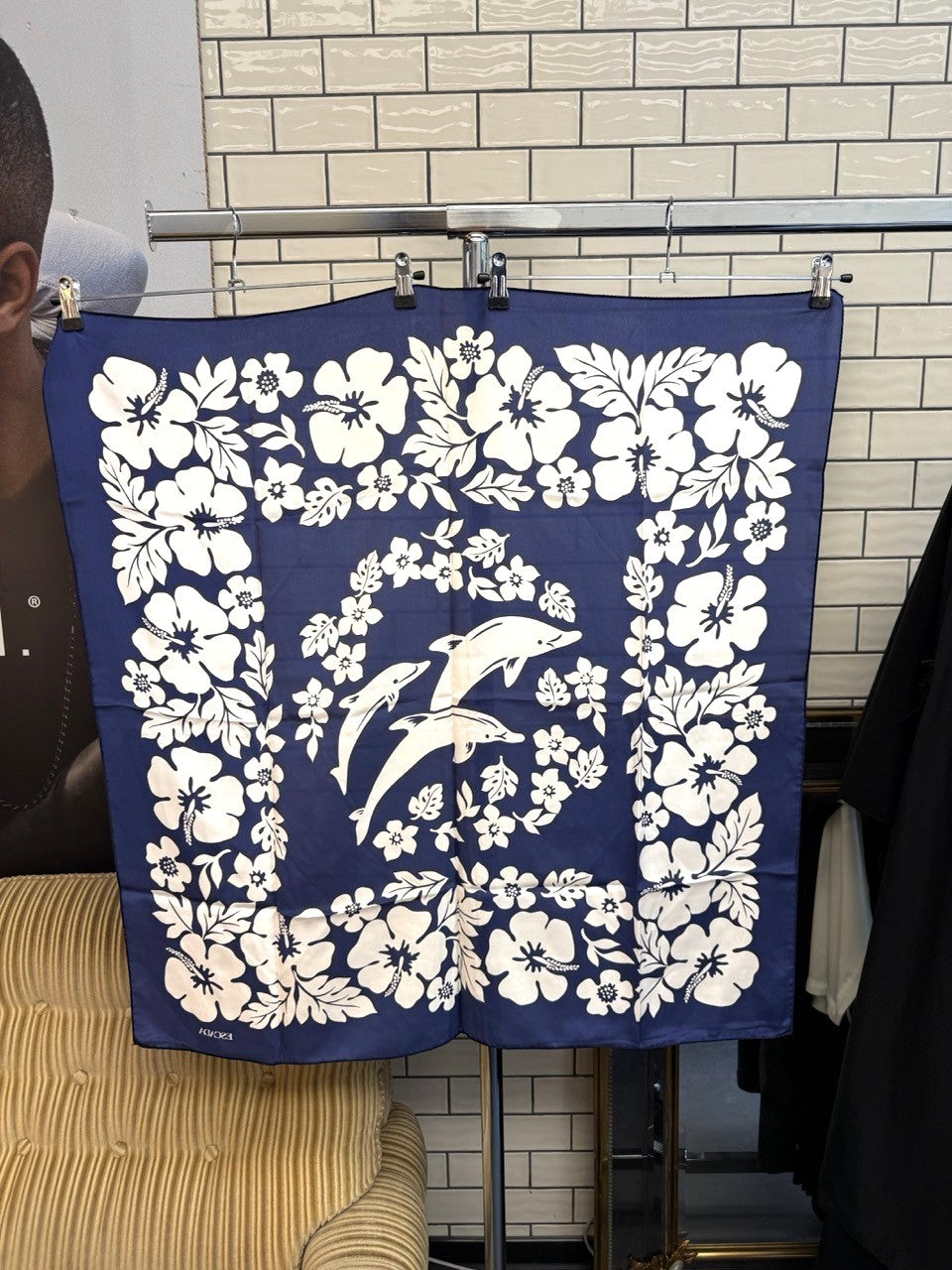 BERLIN VINTAGE CORNER Escada navy blue silk scarf featuring a white floral and dolphin print pattern.