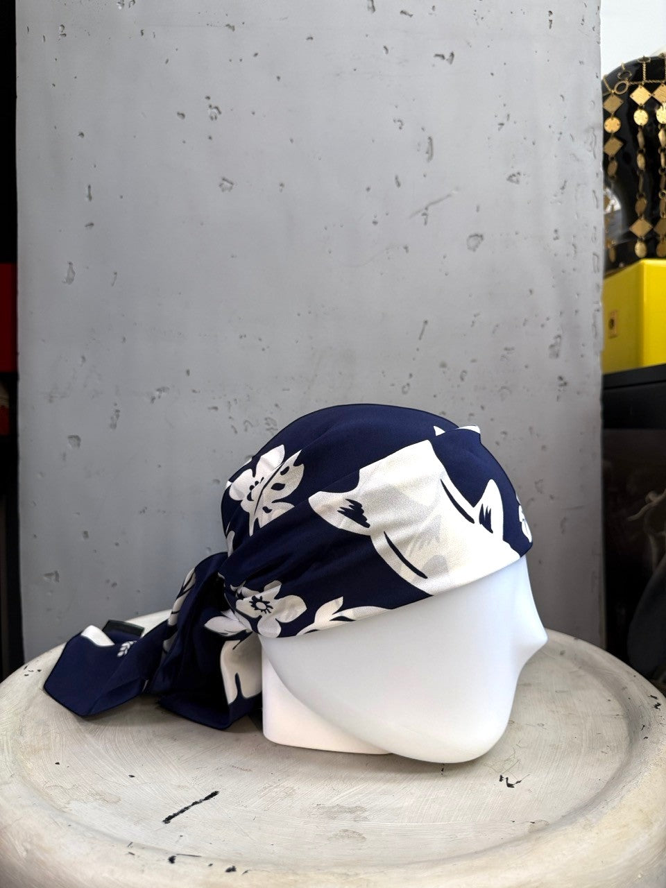 BERLIN VINTAGE CORNER Escada navy blue silk scarf with white floral and dolphin print styled as a headscarf