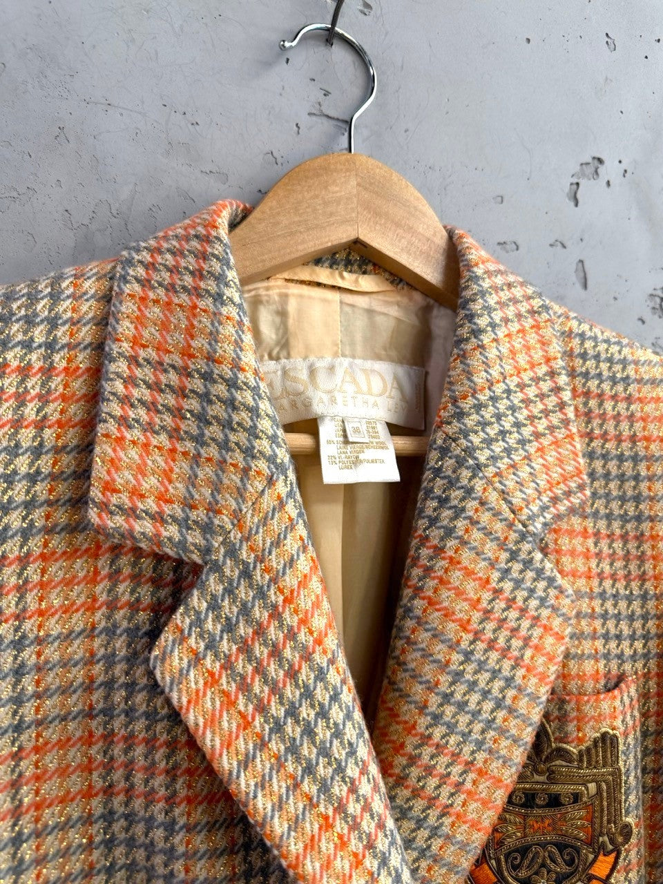 BERLIN VINTAGE CORNER Escada Margaretha Ley vintage orange and grey plaid blazer with metallic lurex and crest patch.
