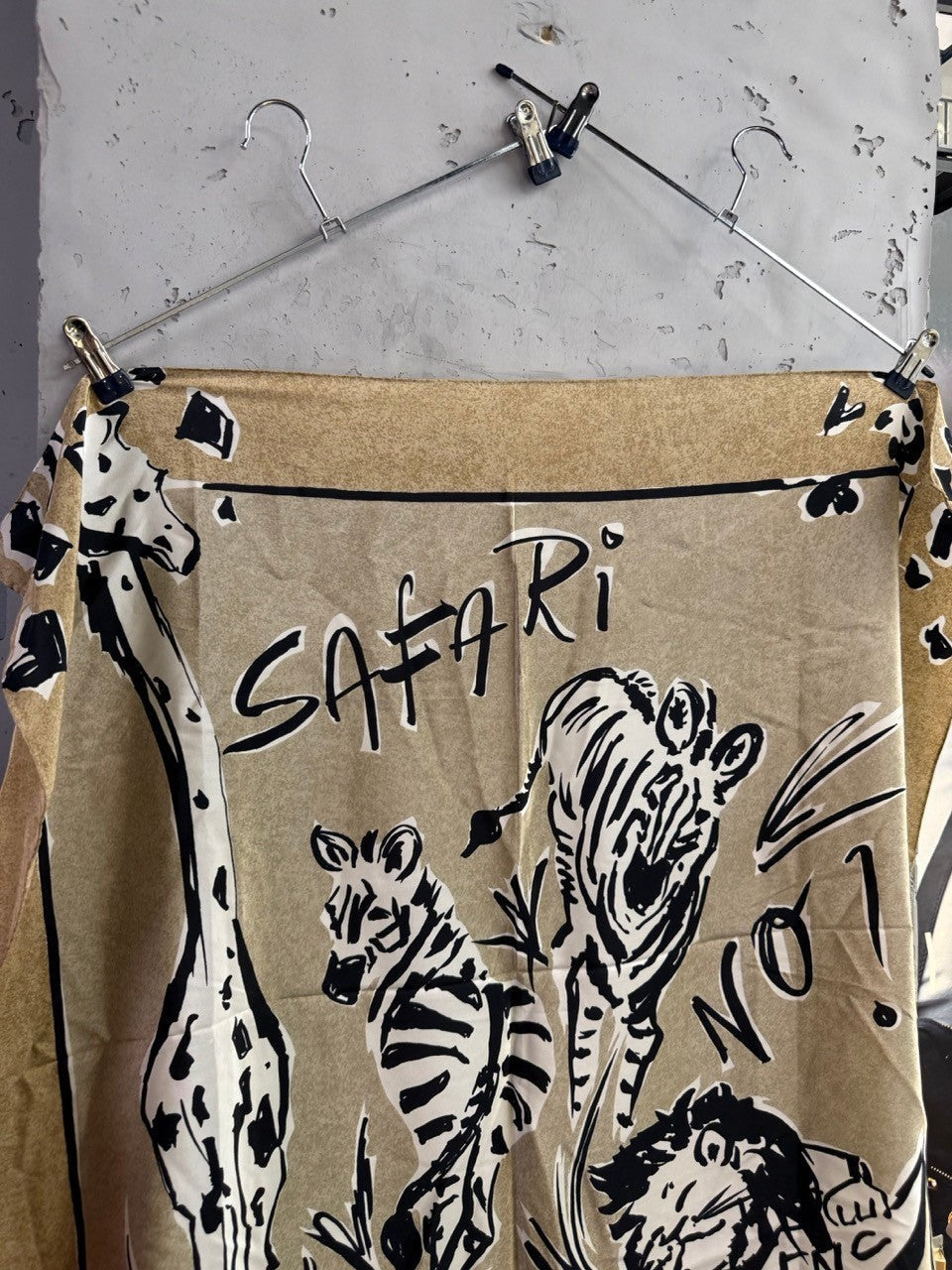 BERLIN VINTAGE CORNER ESCADA silk scarf in tan with black safari wildlife illustrations and artistic typography.