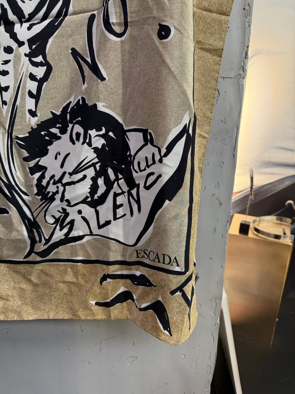 BERLIN VINTAGE CORNER Escada silk scarf in tan with black safari wildlife illustrations and artistic typography.
