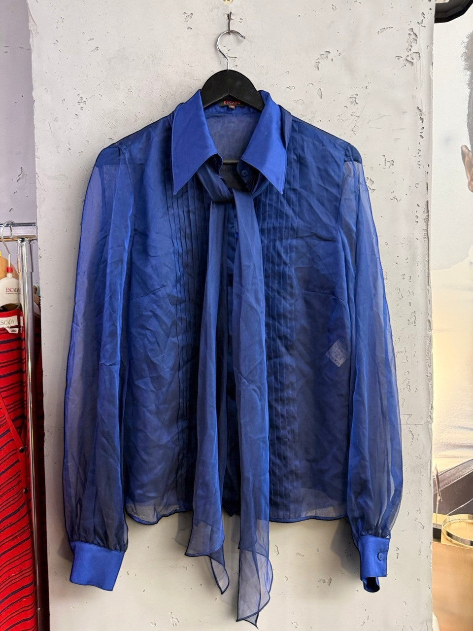 BERLIN VINTAGE CORNER royal blue sheer long sleeve blouse with tie-neck detail and front pintuck pleating.