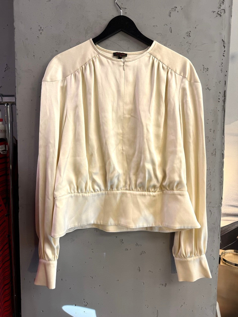 BERLIN VINTAGE CORNER cream Escada silk blouse with gathered shoulders, long sleeves, and front zip closure.