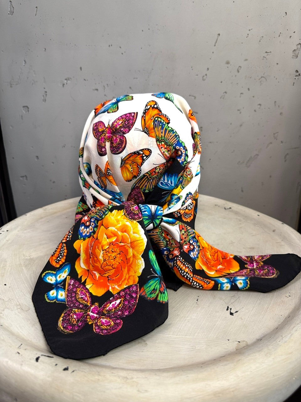 BERLIN VINTAGE CORNER Escada silk square scarf featuring vibrant butterflies and yellow roses on a black border.