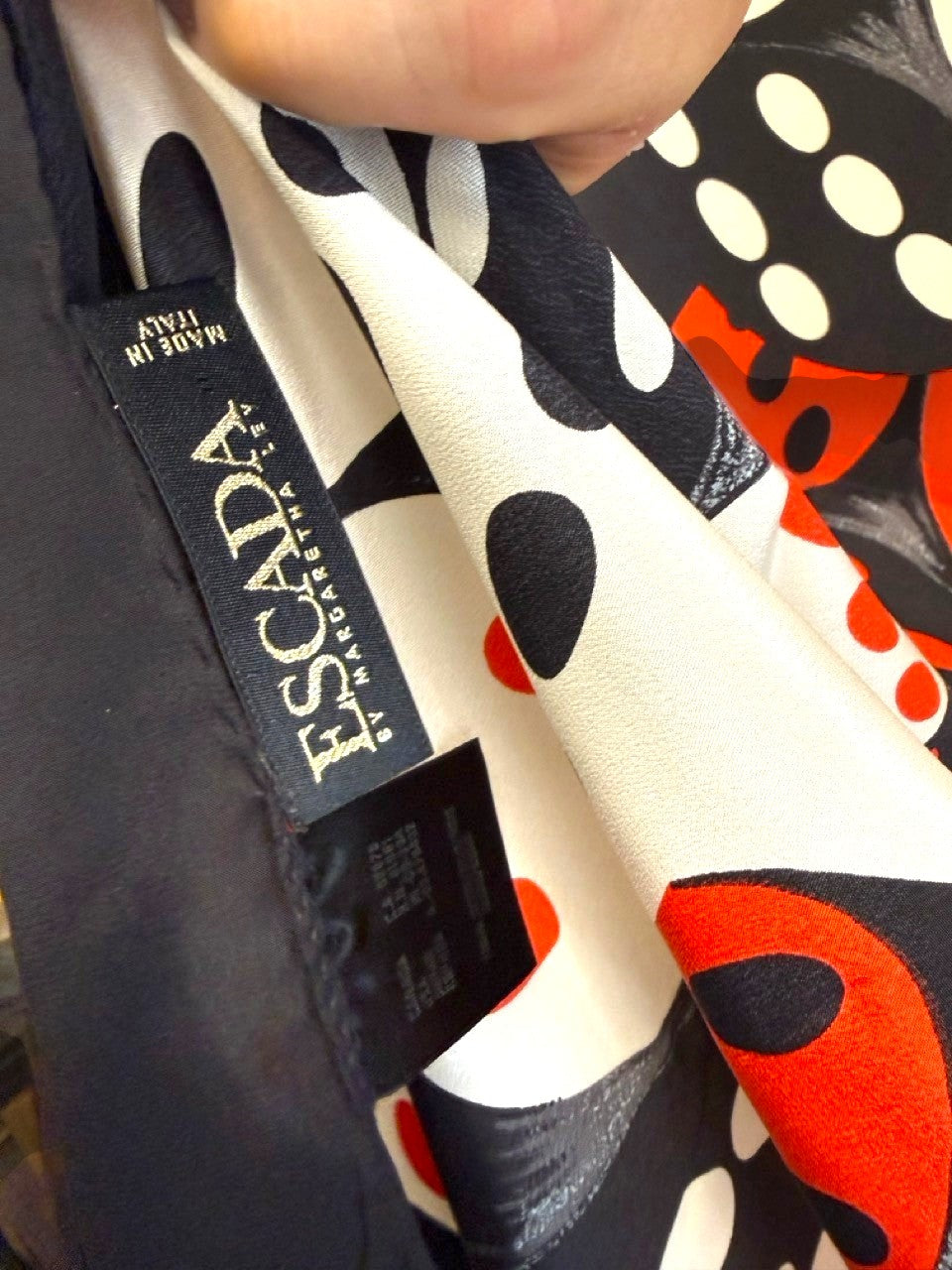 BERLIN VINTAGE CORNER ESCADA by Margaretha Ley silk scarf featuring a black, white, and red dice print label detail