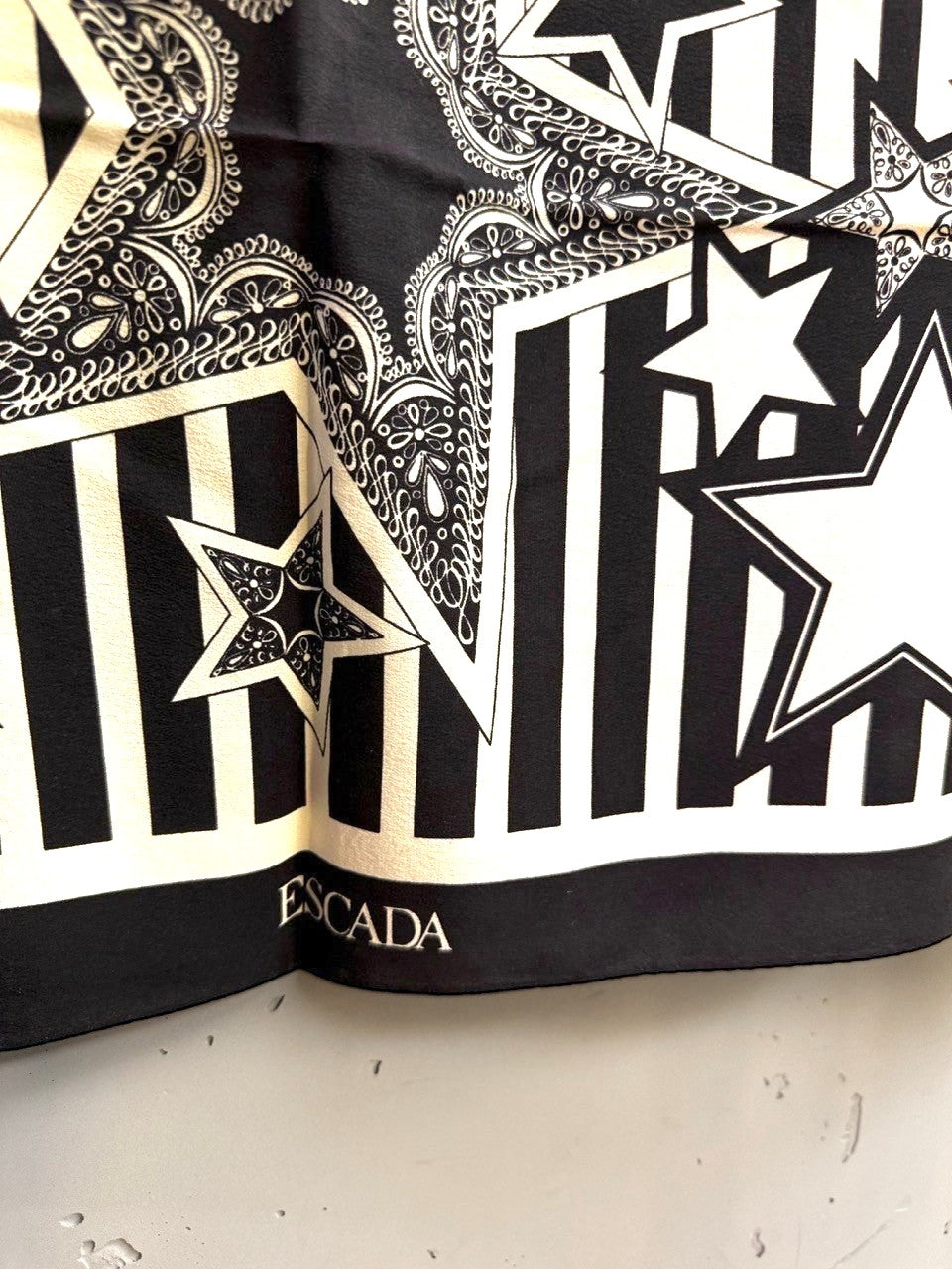 BERLIN VINTAGE CORNER Escada black and white silk scarf with graphic star and stripe print and paisley details.