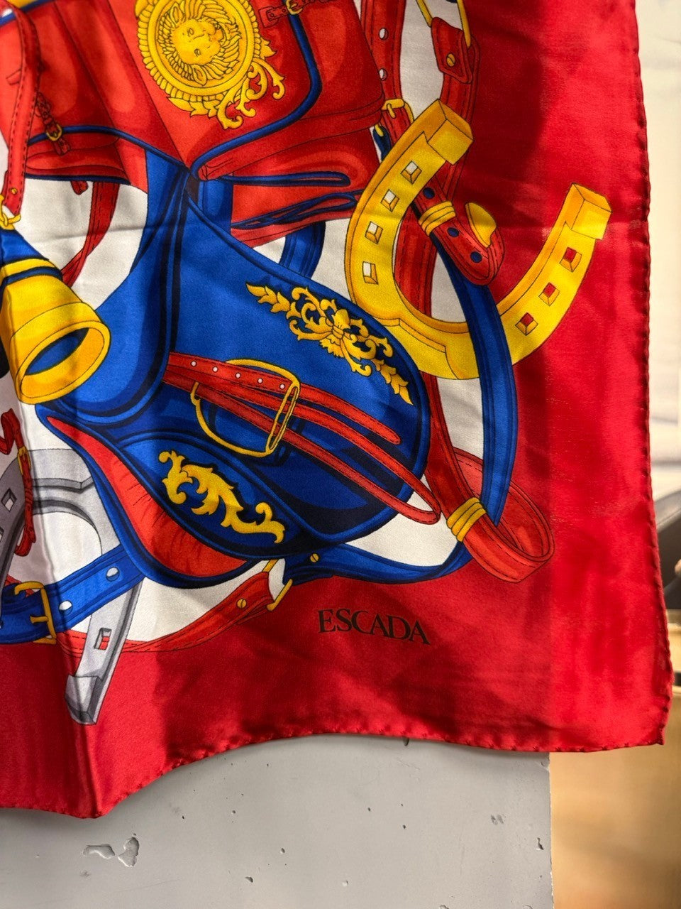 BERLIN VINTAGE CORNER ESCADA silk square scarf with red, blue, and gold equestrian print featuring horseshoes.